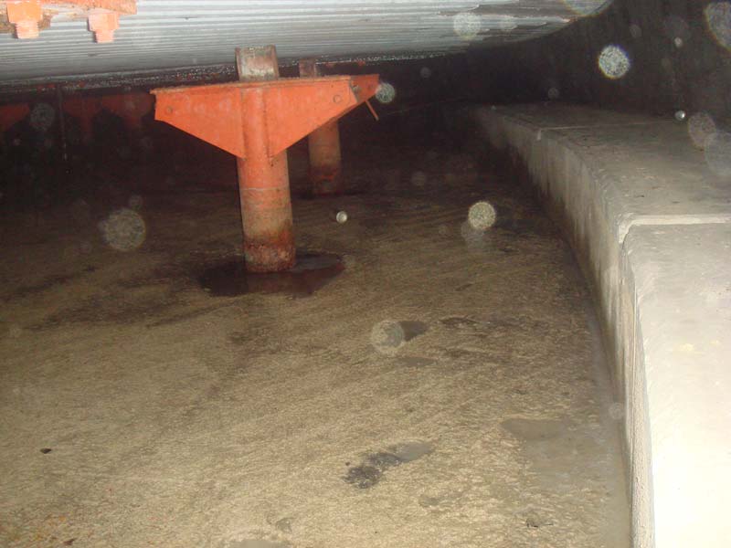 One of the spring beam pedestals.  There used to be two large steel beams suspended from each one of these.  You can see the chunk of steel on top acting as a shim to hold up the floor above.