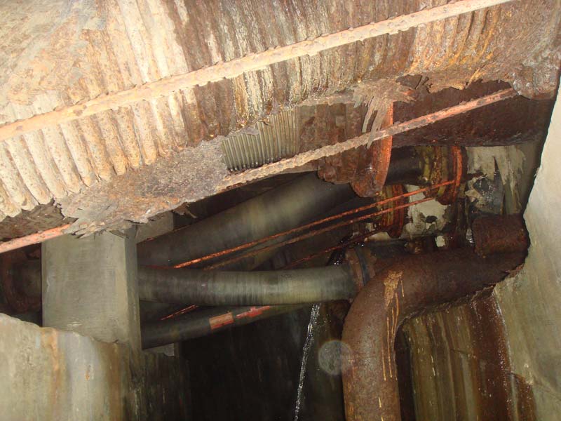 A closer look at the pipes under the power house floor showing some smaller trickles joining the larger flow through the structure.