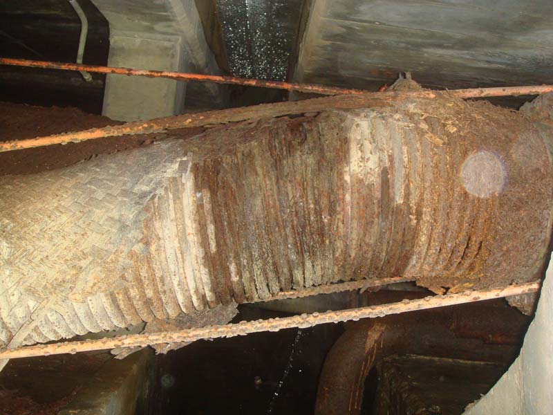 The flexible connection to one of the 16-inch water lines showing the eroded stainless steel braiding.