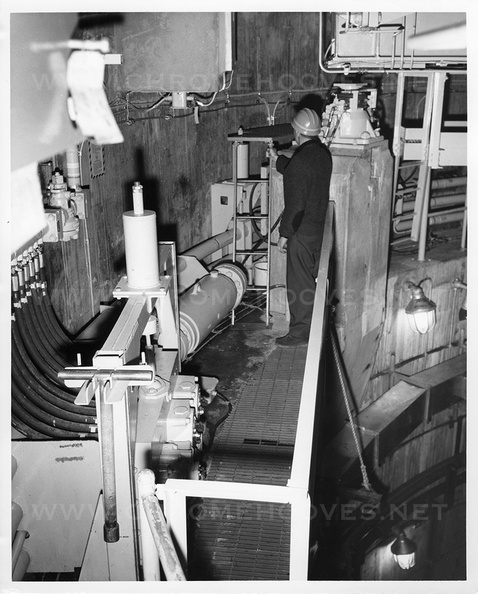 (2 of 2) Unknown AMF engineer at the catwalk level of the launcher, standing next to one of the vertical jacks. Launcher appears to be under construction or undergoing engineering modifications in this photo. Taken: unknown Source: The Martin Co.? titan_group037-1.jpg