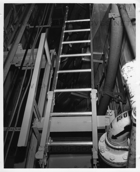 Missile silo, site and launcher numbers unknown. Believed to be Beale 851-A and taken near the personnel elevator, the purpose of this photo is uncertain, but likely it was taken to document an engineering problem with the installation of plumbing, duct work, electrical runs or other work. Taken: circa 1961 Source: Martin Co. titan_group009-1.jpg