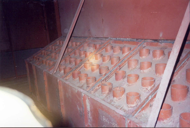 Launcher Air Filtration Facility at Lowry 724-C showing the cyclonic dust separators viewed from above where the air exited the separators through the tops of the many separation tubes. As air traveled through these separators, it would spiral around inside these tubes allowing dust to settle out through the bottom as air moved through. This area leads directly to the centrifugal fan which is separated by a partition wall. Taken: Circa 2002 Source: Myself filtration-16-lafa.jpg